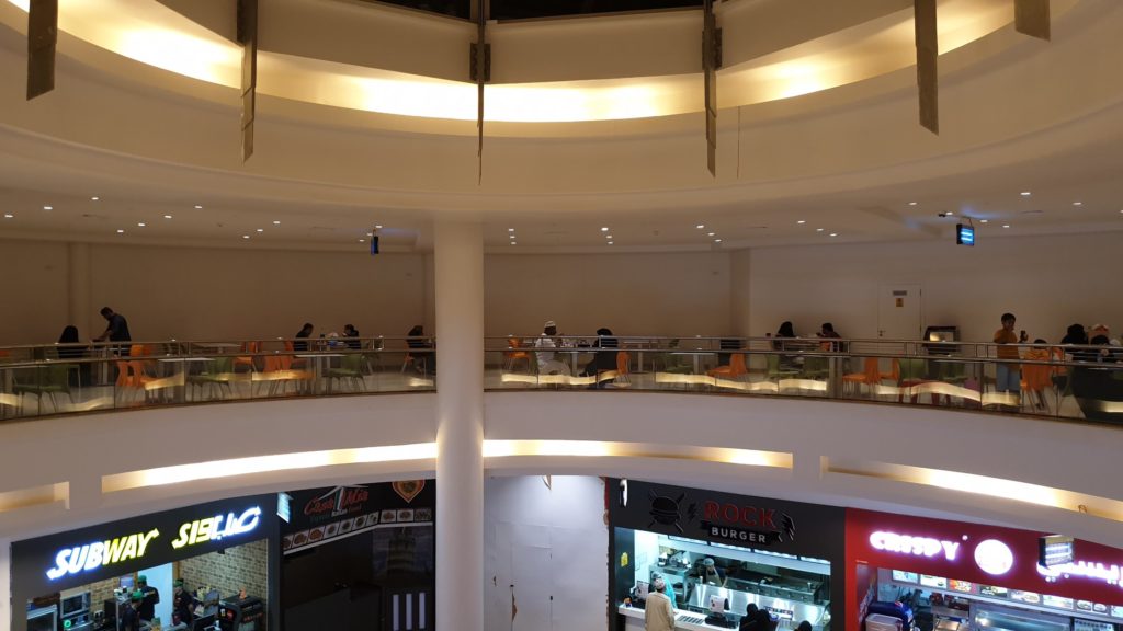 Level 1 sitting area in Salalah Gardens Mall's Food Court 